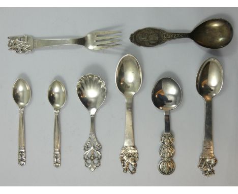 Georg Jensen, two acorn pattern tea spoons, London import 1928, a Danish silver caddy spoon, by Munck, with pierced floral ha
