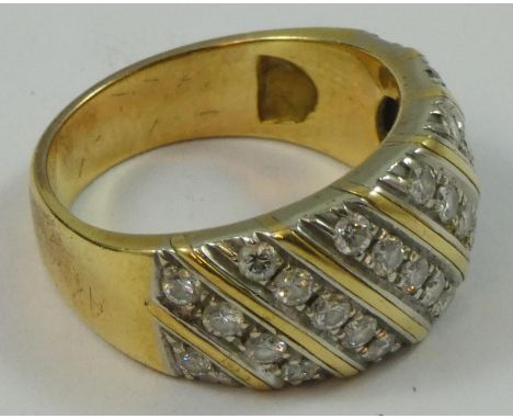 A gold and diamond dress ring, set with six rows of brilliant cut stones, approximately 0.75cts total size L, weight 7.5 gms.
