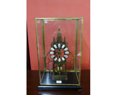 A cased brass skeleton clock, 54cms h 