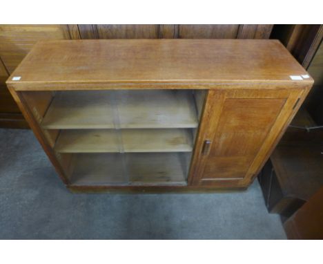 A Heals style Art Deco light oak bookcase, 77cms h, 101cms w, 31cms d 