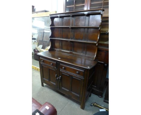 An Ercol dark elm dresser 