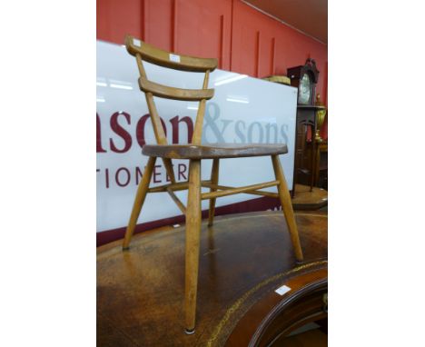 An Ercol Blonde elm and beech child's red dot chair 