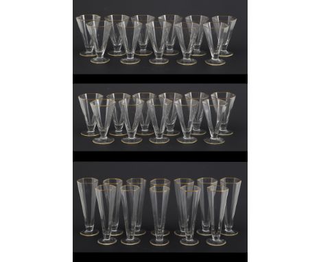 Set of twelve hexagonal glasses in blown crystal with gold edges, composed of flutes, water glasses and wine glasses. 20th ce