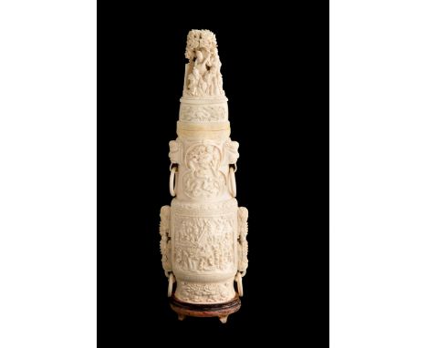 Finely carved ivory vase with scenes of life, dragons and phytomorphic elements, complete with stopper and double circular ha