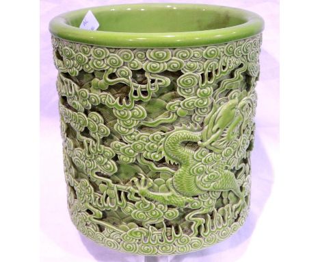Reticulated green ceramic Chinese brush pot with dragon decoration in relief, H: 18 cm, no cracks or chips, crazed throughout