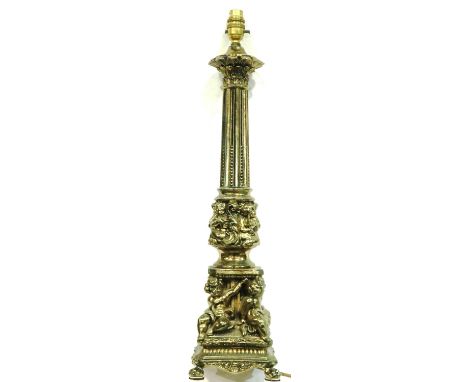 Gilded metal table lamp with cherub relief to base, H: 64 cm. All electrical items in this lot have been PAT tested for safet