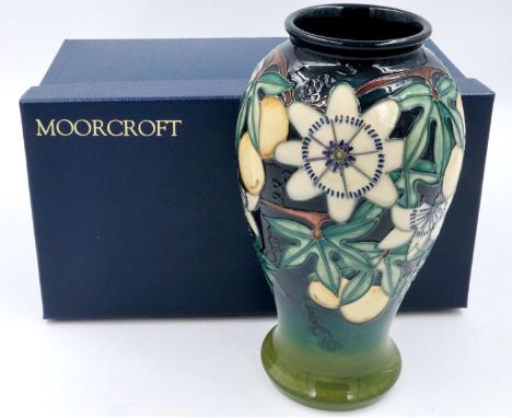 Boxed Moorcroft baluster vase in the Passionfruit pattern, seconds quality, H: 27 cm, no cracks or chips. P&amp;P Group 1 (£1