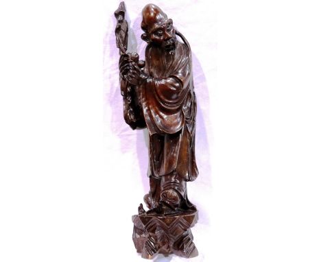 Large carved wood figure of an immortal standing on a bat, H: 60 cm. P&amp;P Group 2 (£18+VAT for the first lot and £3+VAT fo