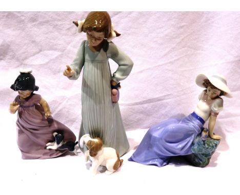 Three Nao figurines, girl with fish, and two girls with dogs, largest H: 27 cm, no cracks or chips. P&amp;P Group 3 (£25+VAT 