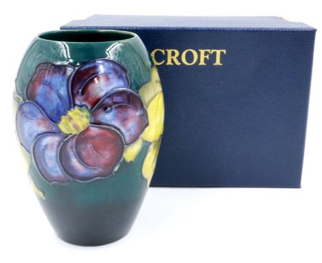 Boxed Moorcroft vase in the Clematis pattern, H: 13 cm, no cracks or chips, crazing throughout. P&amp;P Group 1 (£14+VAT for 