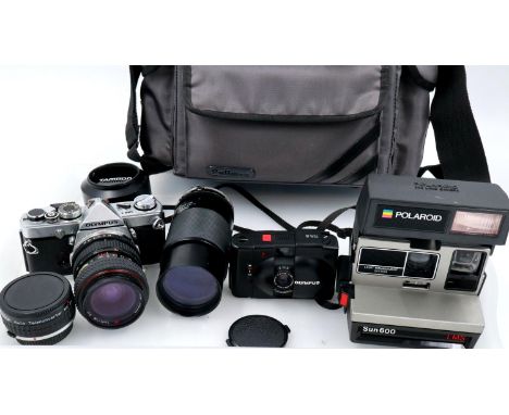 Olympus OM1, XA2 and a Polaroid camera in travel bag, appear to be working at lotting. P&amp;P Group 2 (£18+VAT for the first