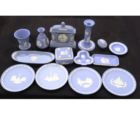 Fourteen pieces of Wedgwood blue Jasperware including a clock, no cracks or chips, largest H: 18 cm. P&amp;P Group 3 (£25+VAT