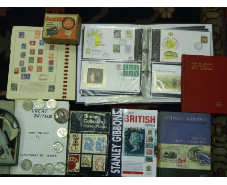 Two stamp albums and UK Mint stamp reference books. P&amp;P Group 2 (£18+VAT for the first lot and £3+VAT for subsequent lots