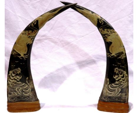 Pair of large early 20th century carved buffalo horns, each decorated with dragons, H: 42 cm. P&amp;P Group 3 (£25+VAT for th