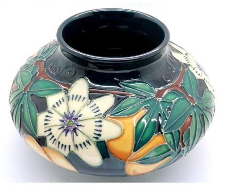 Blue ground Moorcroft squat vase in the Passion Fruit pattern, H: 13 cm, no cracks or chips, crazing throughout. P&amp;P Grou