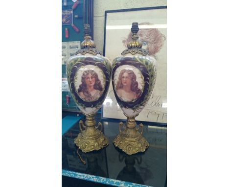 A pair of early 20th century French glass and brass urn shaped table lamp bases with hand painted portrait decoration of youn