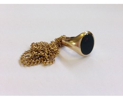 A 9 carat gold gent's bloodstone set signet ring together with an unmarked yellow metal neck chain.