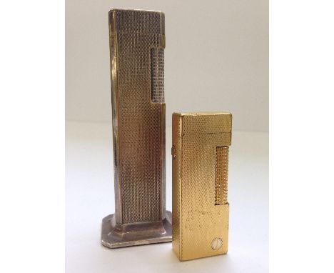 A Dunhill Tallboy silver plate engine turned table lighter together with a gold plate cased engine turned Dunhill pocket ciga