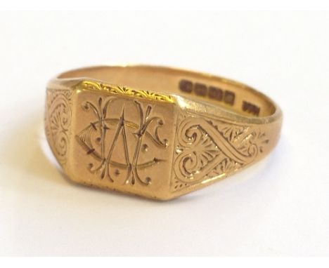 An 18 carat gold gent's Signet ring with monogram decoration (5.8 grams).