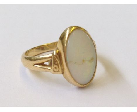 A gold opal set dress ring (opal damaged)