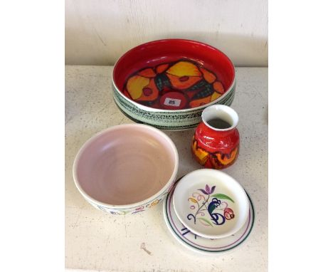 A large Poole Pottery Delphis fruit bowl together with four other Poole Pottery items.