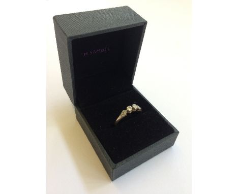 An 18 carat gold two stone diamond ladies' ring.