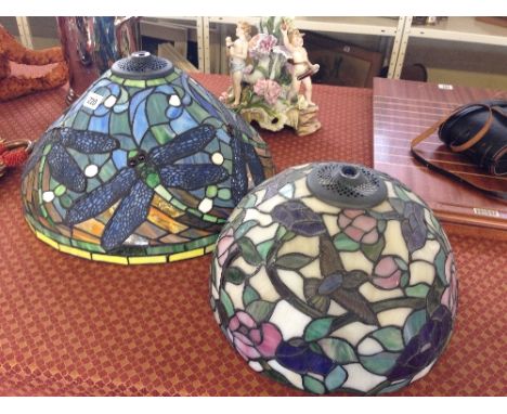 A Tiffany style leaded glass light shade, decorated with dragonflies together with another, decorated with birds (latter mark