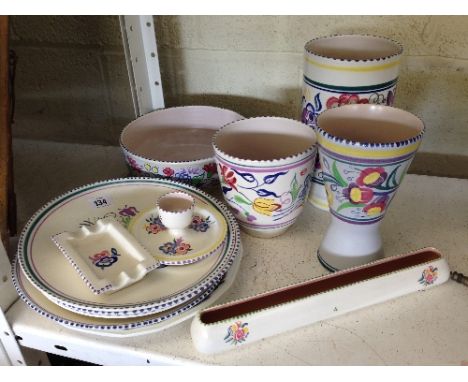 A large quantity of white bodied Poole Pottery.