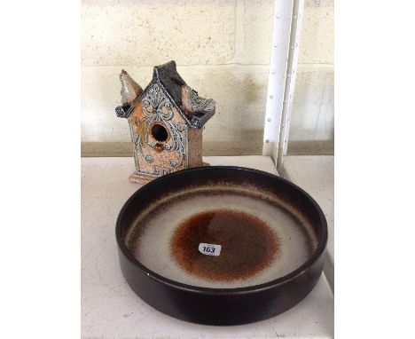 A West German circular glazed dish together with an Art pottery ceramic bird house.