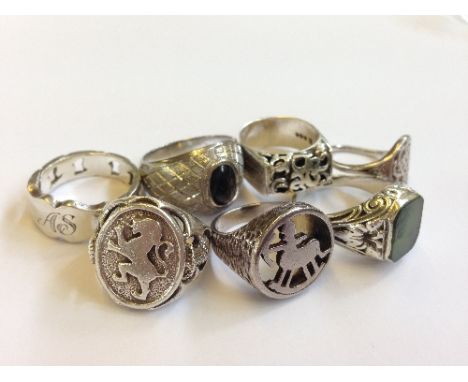 Seven various silver rings including a John Heart Iona Arts & Crafts style ring and a Serpentine set ring.