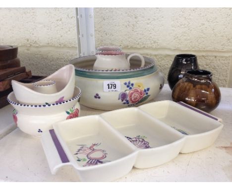 A collection of various Poole Pottery items.