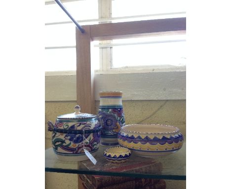 A Poole Pottery vase decorated in the PB Bluebird pattern together with a matching biscuit barrel and two QO pattern bowls (e