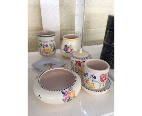 Seven various white bodied Poole Pottery items.