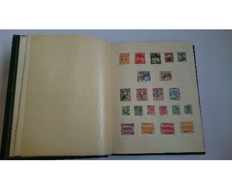 An early 20th century stamp album containing a collection of Commonwealth stamps to George VI, Cat. value in excess of £3,000