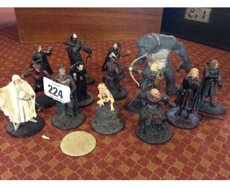 A collection of various painted metal Warrior Lord of The Rings figures.