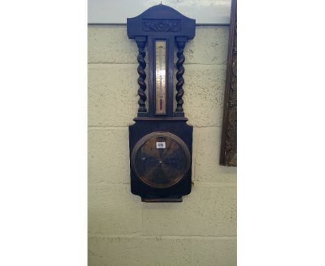 An early 20th century oak cased wall barometer.