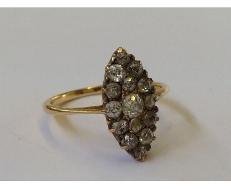 An 18 carat gold Marquise diamond set ring.