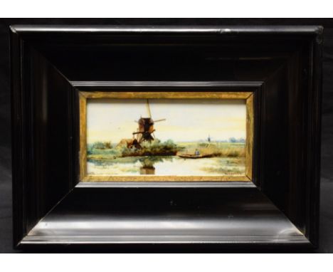 A Dutch ceramic tile, painted in enamels with windmills and waterways, signed Rozenburg, 7.5cm x 15cm, framed