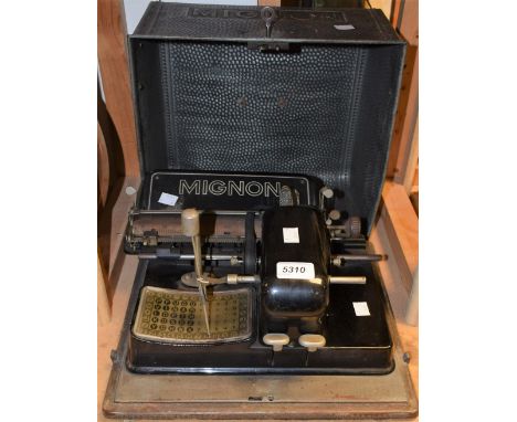 A Mignon early 20th century typewriter with tin cover 