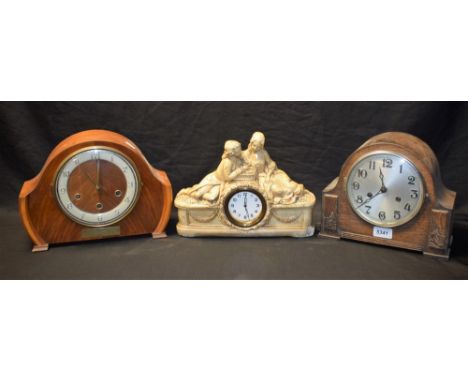 An oak cased Napoleon hat mantel clock; another, similar; a plaster cast clock, courting couple (3)