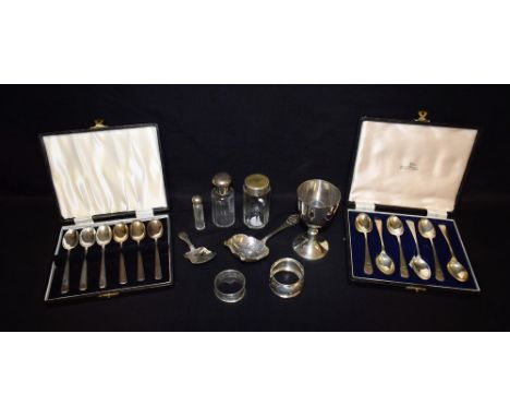 A silver tea strainer, Viners, Sheffield 1951; a silver caddy spoon, bright cut, James Collins, Birmingham 1850; a set of sil