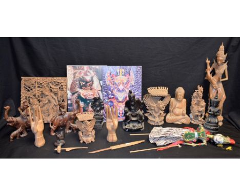A carved wooden Buddha; a Chinese root carving, of an elder; a Thai puppet; a pair of carved elephants; others, similar
