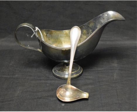 A continental silver sauce boat and ladle, marked 800