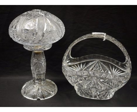 A mid-20th century cut glass table lamp; a cut glass handled fruit basket