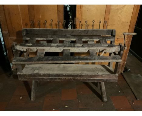 A 19th century Hank Winder, 12 iron pig tail loop rail, wooden off set ladder two bar roller, iron fittings, wooden handle, 1