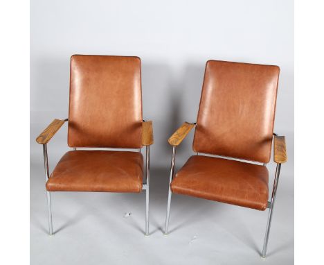 A pair of 1960s' American Pace chairs by Simmons, with oak armrest on tubular steel, brown leather upholstery, makers labels,