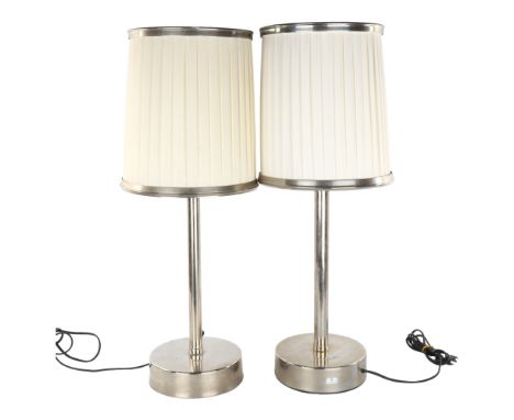 A pair of late 20th century steel based table lamps, possibly Lambert et Fils, with makers label, height 68cm.Wired for conti