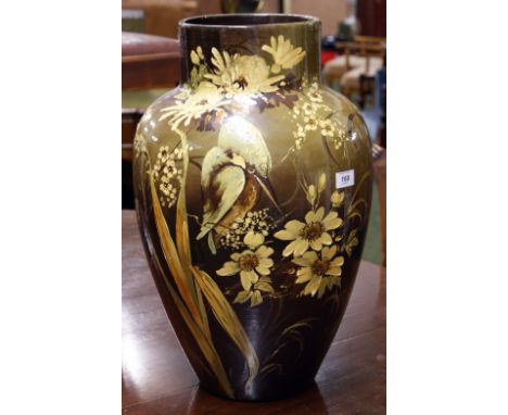 A ceramic baluster vase of large proportions, painted and tube-line decorated with kingfishers against a brown ground. Signat