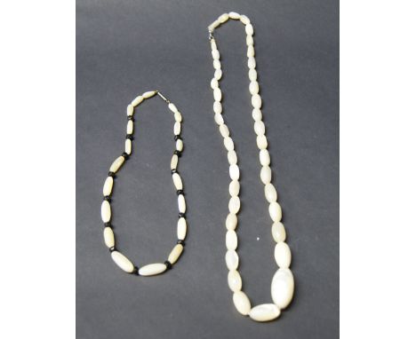 Large mother of pearl necklace plus another 