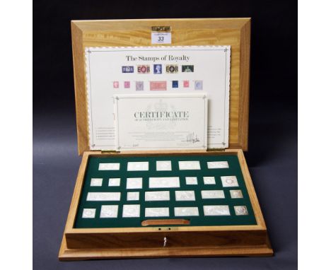 The Royal Stamp Collection, a cased set of .925 silver proof stamps, with certificates, polishing cloth, letters of correspon